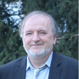 Dr. András Dér